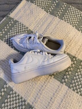 Women’s White Nike sneakers
